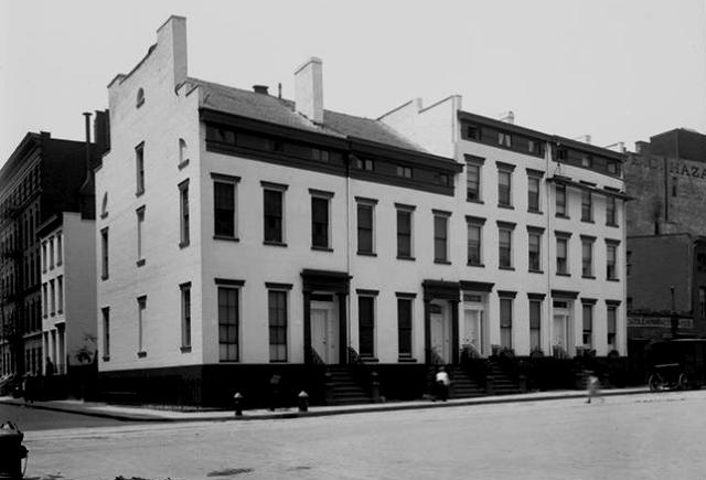 In this 1915 photograph of Nos. 3-6 Sheridan Square, you can just make out the one-story building at far right, which was occupied by T. Samoski, a saddle and harness maker. Museum of the City of New York Collections