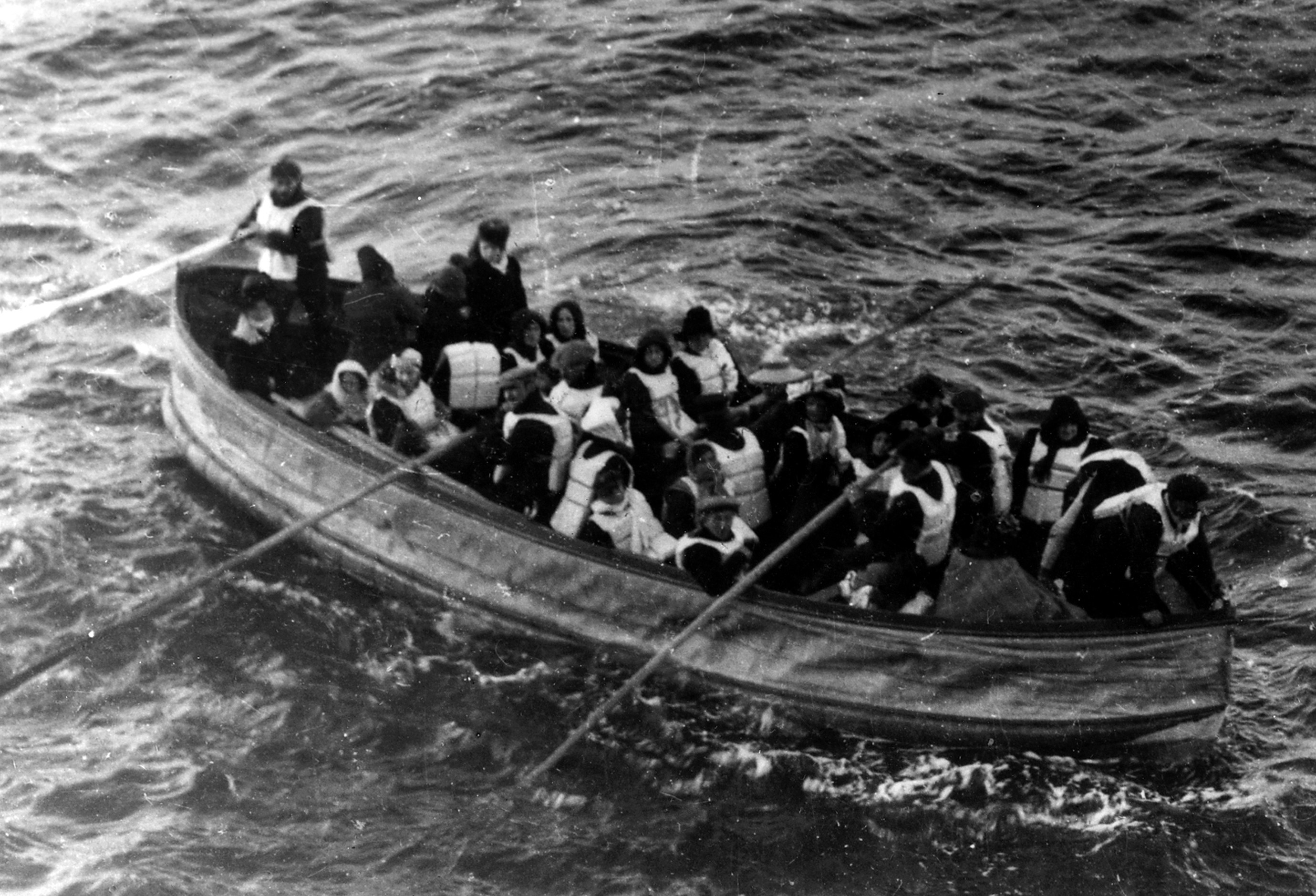  Titanic passengers in Collapsible Boat D, then partially flooded with ice-cold water, approach RMS Carpathia at 7:15 a.m. on April 15, 1912. 