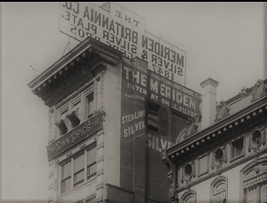 In this closeup of the top floors of 208 Fifth Avenue, you can see the marquee for Town Topics and the windows from which The Laird and Little Billee made their fatal leaps to the pavement below. 