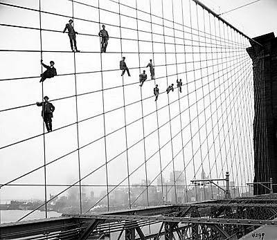 The Brooklyn Bridge workers must have had cat-like skills in order to cling to and balance on the steel cables. 