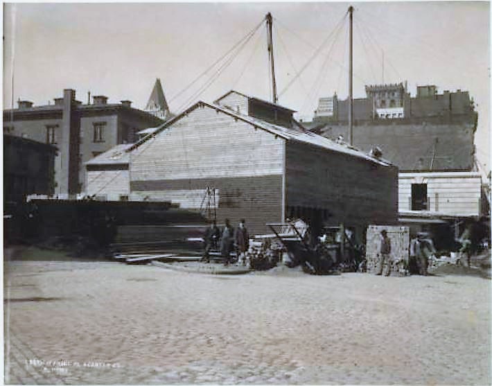 This photo, taken in 1901, shows Centre Street between Chambers Street on the left and Reade Street on the right. In the photo is the partially constructed Hall of Records and a frame work-shed used by the subway construction workers. Also, a low structure on the southwest corner that was occupied by Fire Engine Company No. 7 and Hook and Ladder No. 1. The brick building behind the Hall of Records could possibly be 17 Centre Street, just before it was torn down.