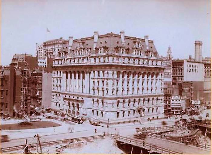 In this 1908 photo, the Hall of Records building is completed. Across the street, the vacant lot is being prepared for the David N. Dinkins Manhattan Municipal Building, which was designed by McKim, Mead and White and constructed between 1909-1914. NYPL Digital Collections