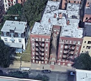 The former Moller mansion, originally located on Kingsbridge Avenue, looks out of place next to my father's former apartment building on Godwin Terrace.