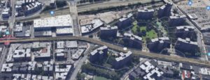 In this aerial view, Godwin Terrace and the old Godwin property is on the left; the Harlem River and Spuyten Duyvil Creek were where the large housing development and playground are on the right. Godwin's house was near the triangle by the elevated train tracks.