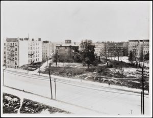 By 1913, when this photo was taken, numerous lots on the old Fox estate had been sold and developed, leaving the once grand mansion hanging on for dear life amid large tenement apartments.