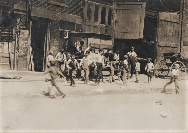 Gangs of young street urchins and older boys were a common sight in tenement neighborhoods such as Hell’s Kitchen, pictured here in the early 1900s. 