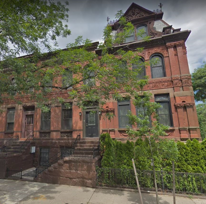 Charles Nielsen and his large family lived in this stunning anchor house at the corner of Linden and Bushwick Avenues. The row of 11 Queen Anne houses was designed by architect Frank Keith Irving and constructed in 1888. 