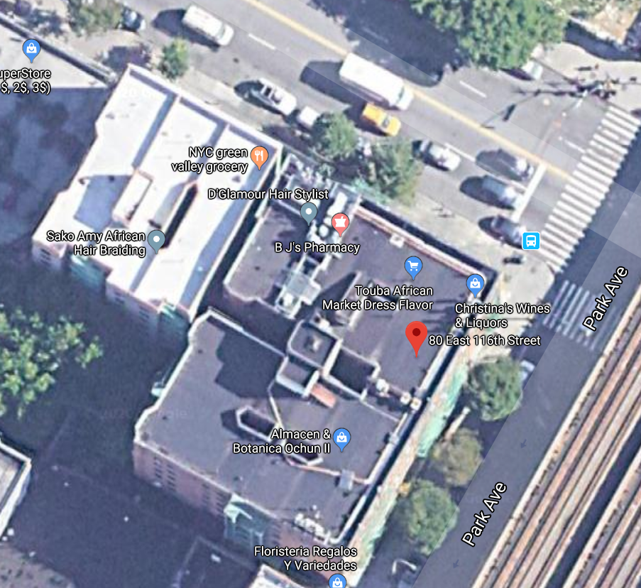 Residents trapped on the roof of the Hermione building created a bridge from some wood slats to cross over to the adjoining building on East 116th Street. 