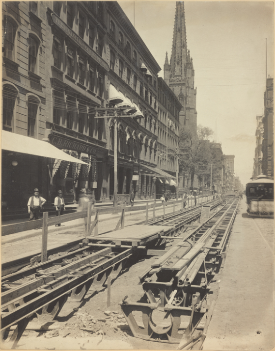 The Adams Express Company occupied the building on the far left. When this photo was taken around 1885 during excavation work for the new streetcar line, 61 Broadway was occupied by the C.B. Richard Company’s Foreign Express. New York Public Library Digital Collections