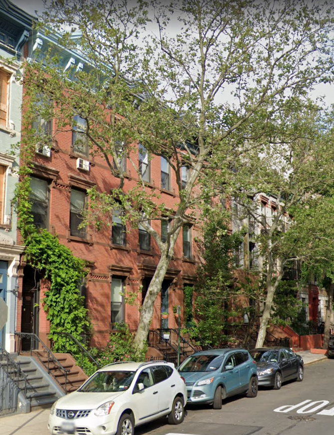 Caroline Ewen's three-story brownstone on East 101st Street (middle) as it looks today. I wonder if there are any cats in the backyard? 