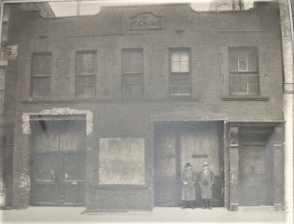 Aloysius Dill and his family lived on the top floor of the Henry Bock building at 426-428 East 75th Street. Dill operated his blacksmith shop on the ground floor and kept about 21 horses in stables in the basement. This photo was taken about 1939.