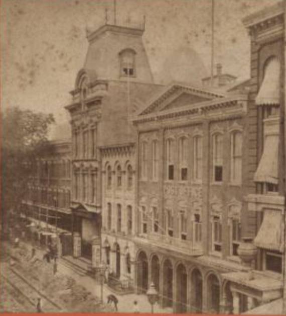 In 1867, the Brooklyn General Post Office moved into a new building  on Washington Street between Johnson Street and Myrtle Avenue, next to the 41st Precinct Station House and the Brooklyn Theatre (the theatre was erected in 1871 and burned down in 1876). Look closely and you can see "Post Office" on the building. 