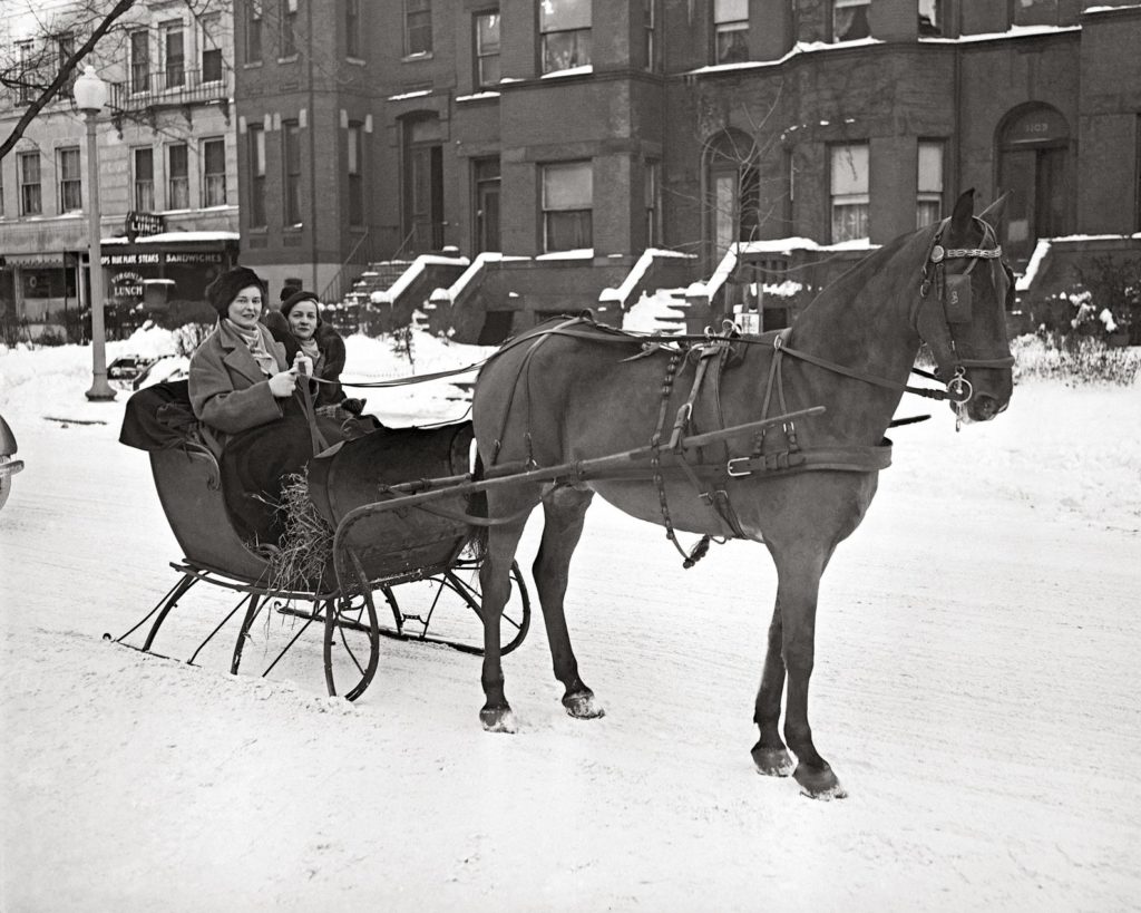 Horse-drawn sleds, like this one pictured in 1935, came to the rescue for pregnant women and ill patients in 1947. 
Horse tale of Old New York