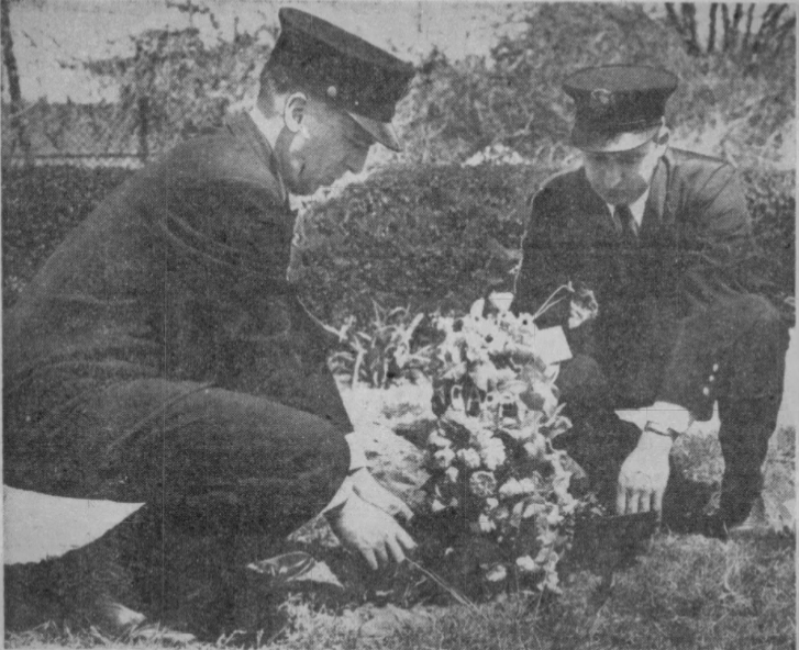 FDNY Firemen Francis Hickey and Eugene Uhl trim Cappy’s grave following his funeral at the Bide-A-Wee cemetery on May 11, 1950.