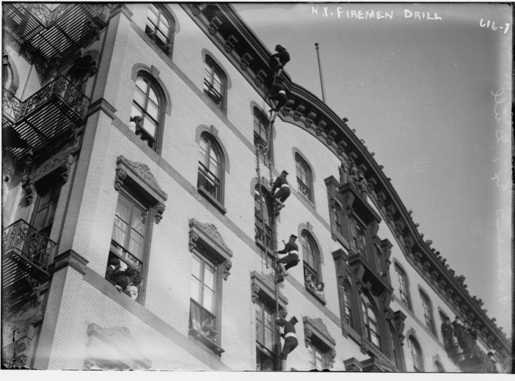 New York firemen demonstrate scaling ladders during a drill in the early 20th century. Library of Congress